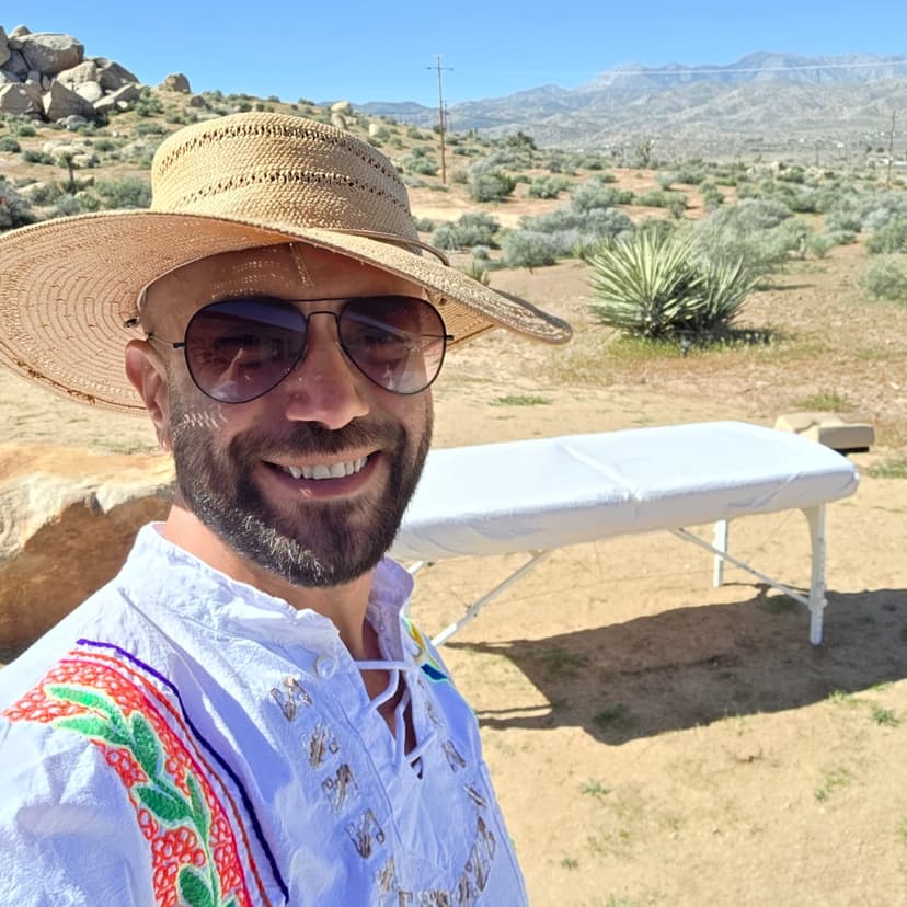 Zorik at Joshua Tree with his massage table in the desert