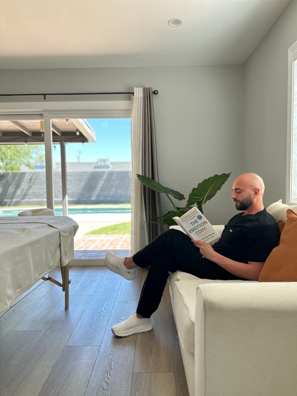 Zorik reading The Emotion Code in his studio